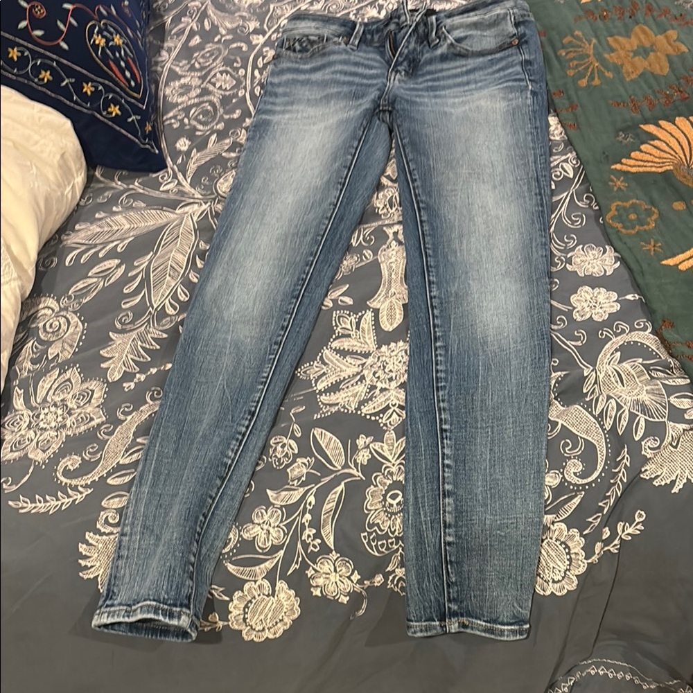 Buckle Blue Skinny Jeans with Distressed Details